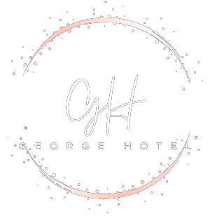 The logo for george hotel is a circle with the word george hotel in it.