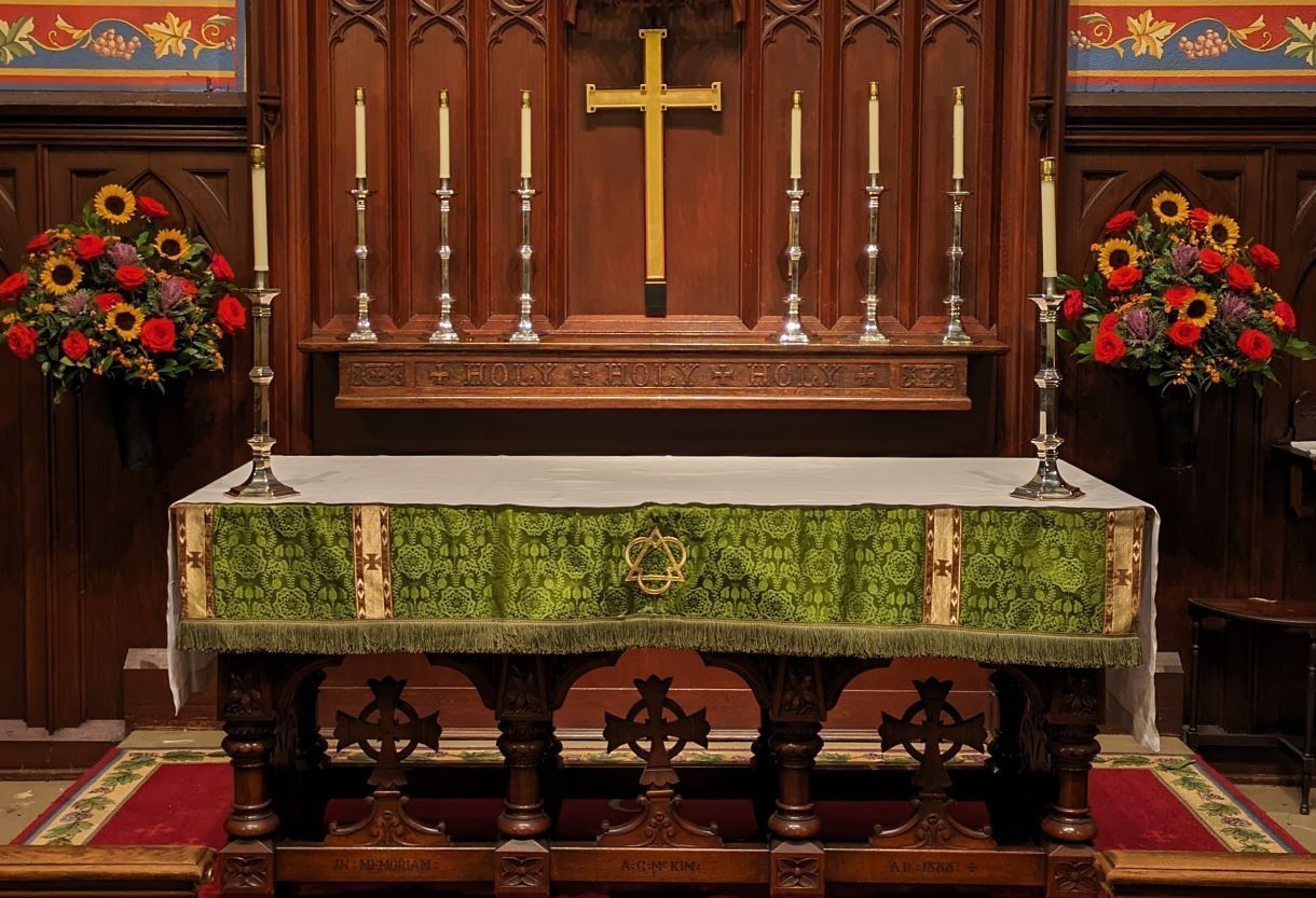 All Souls altar and reredos with Autumn flowers
