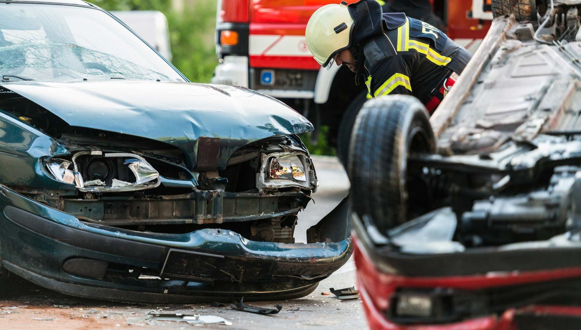Car accident scene — Mildura, VIC — United Panel Works Cars damaged in a collision with a firefighter attending.