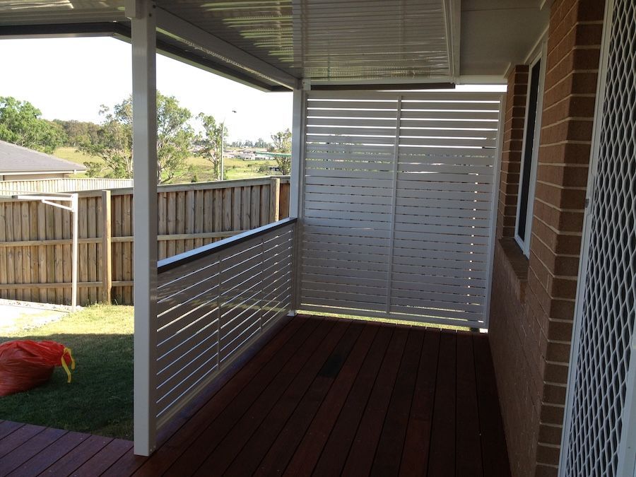 A White Privacy Screen on a Wooden Deck — Newcastle & MidCoast Privacy Screens and Gates In Mid North Coast, NSW