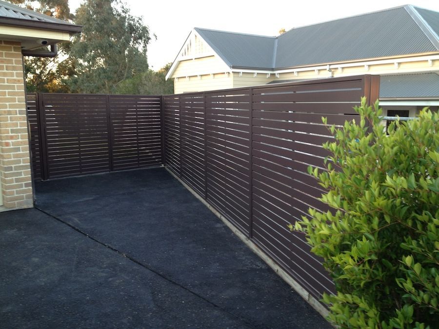 A Brown Privacy Screen on the Side of a House — Newcastle & MidCoast Privacy Screens and Gates In Kurri Kurri, NSW