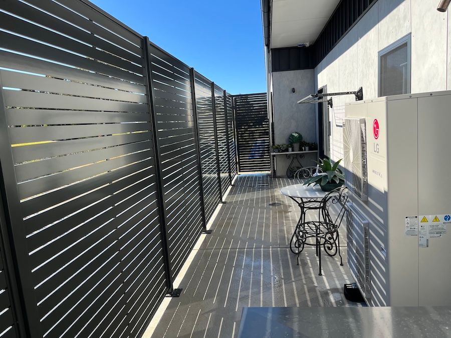 A Black Privacy Screen on the Side of a House — Newcastle & MidCoast Privacy Screens and Gates In Kurri Kurri, NSW