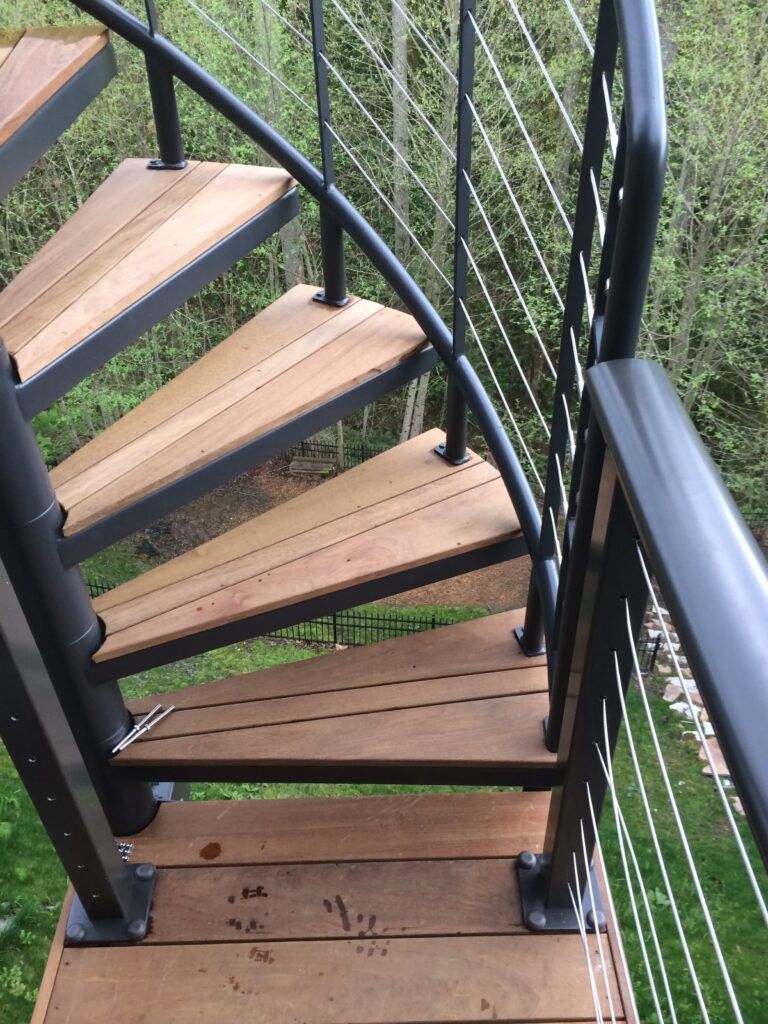 Custom Circular Staircase On Elevated Ipe Deck In Forest Heights Built by Creative Fences & Decks