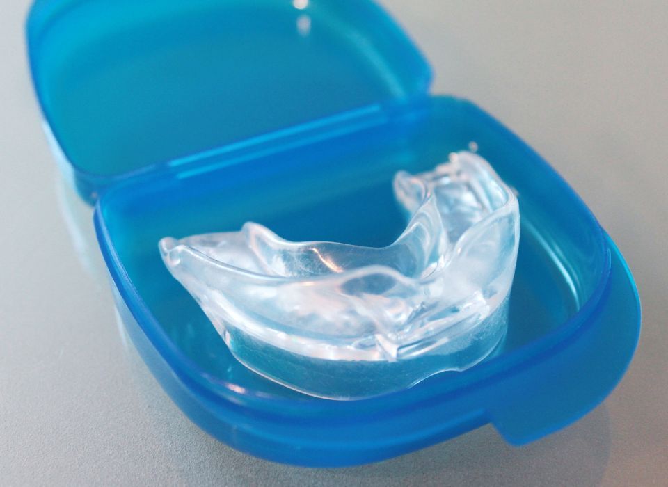 Clear dental mouthguard in blue plastic case