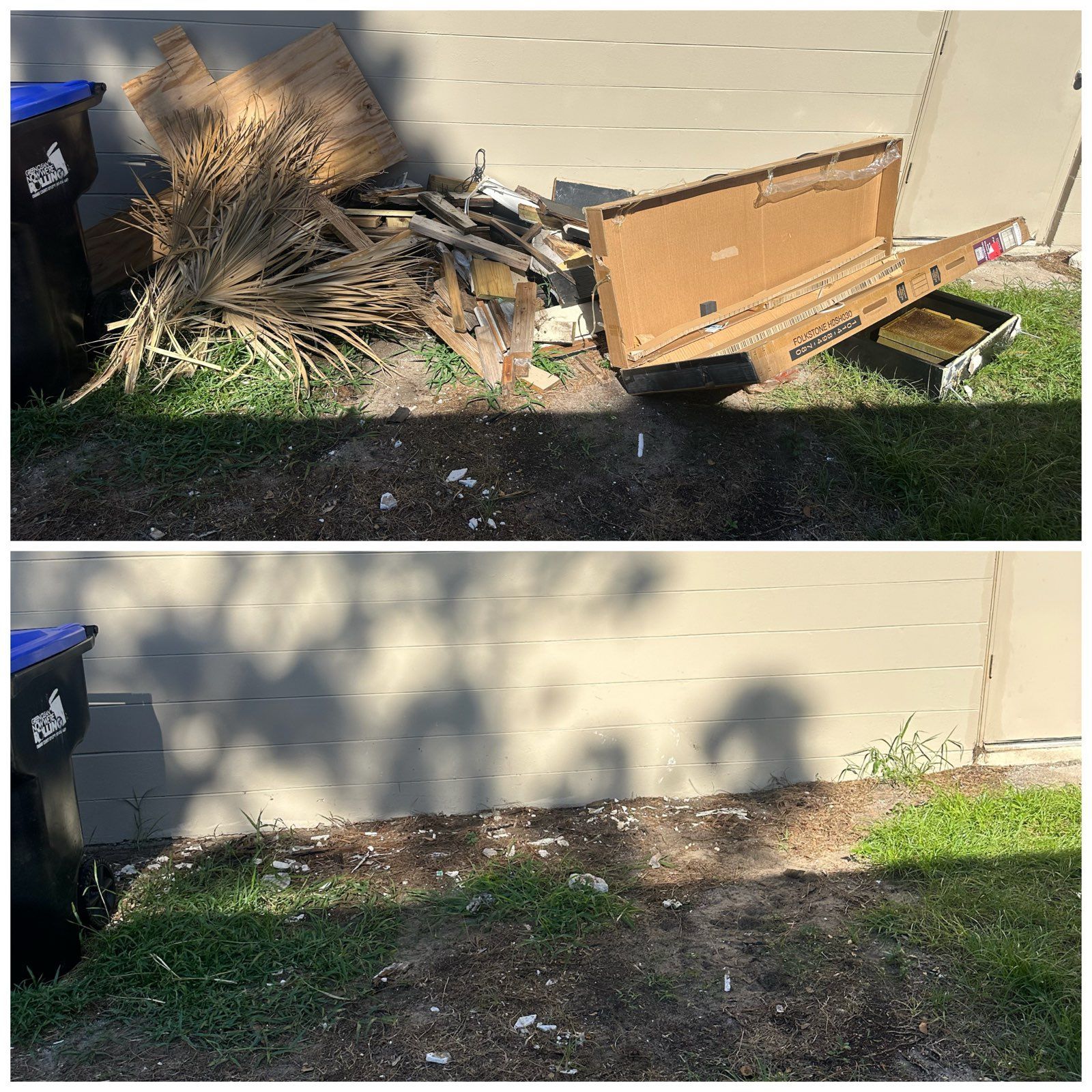 Backyard by tan house wall: debris pile and broken wooden panel removed, leaving cleared dirt and grass.