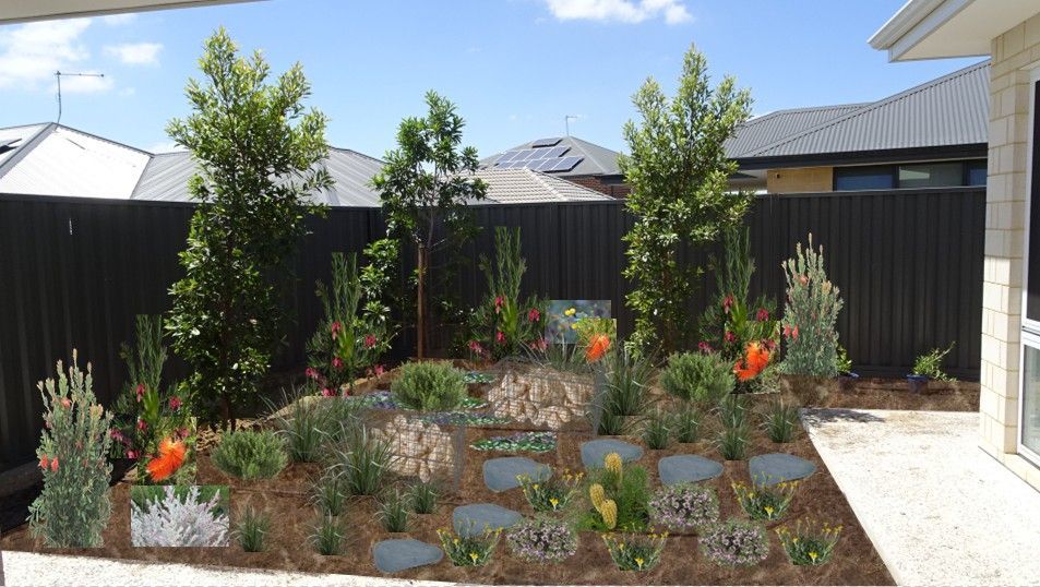 Landscaped backyard with trees, plants, stone path, and dark fence under a blue sky.