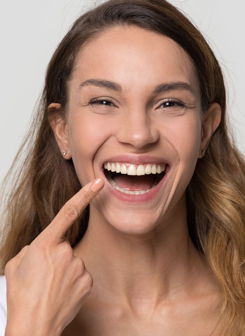 Smiling woman with radiant white teeth showcasing cosmetic dental services. Smiling woman with radiant white teeth showcasing cosmetic dental services.