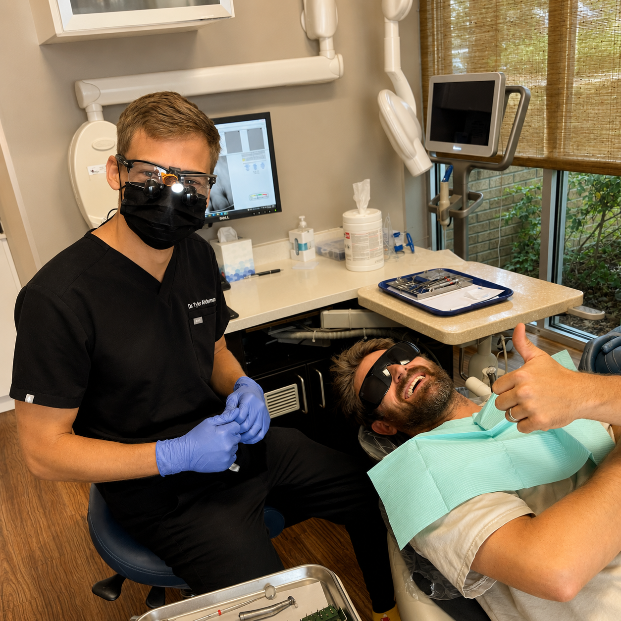 Dentist with smiling patient during a dental appointment at Mt Pleasant Modern Dentistry