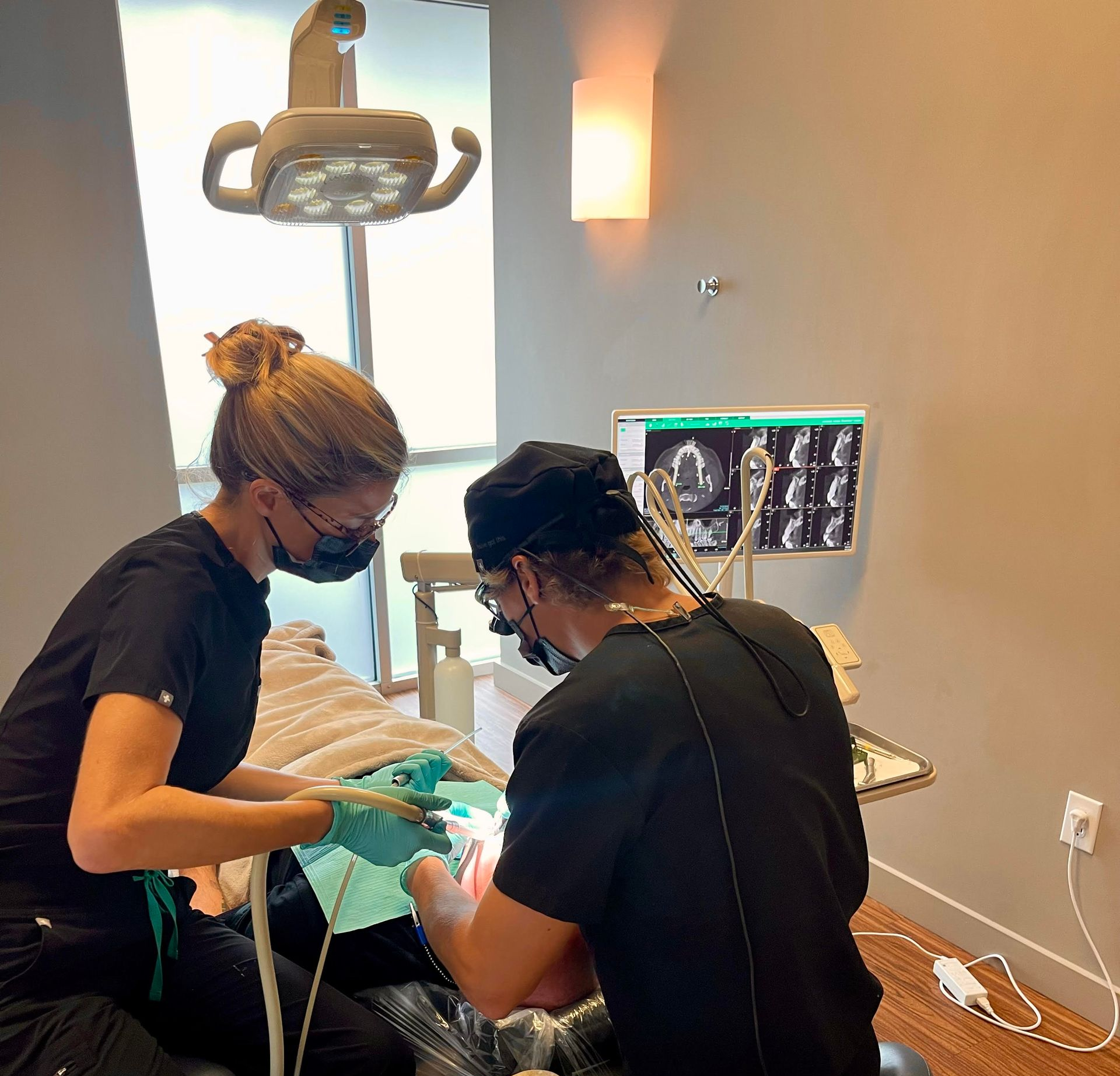Dental team providing patient treatment at Mt Pleasant Modern Dentistry