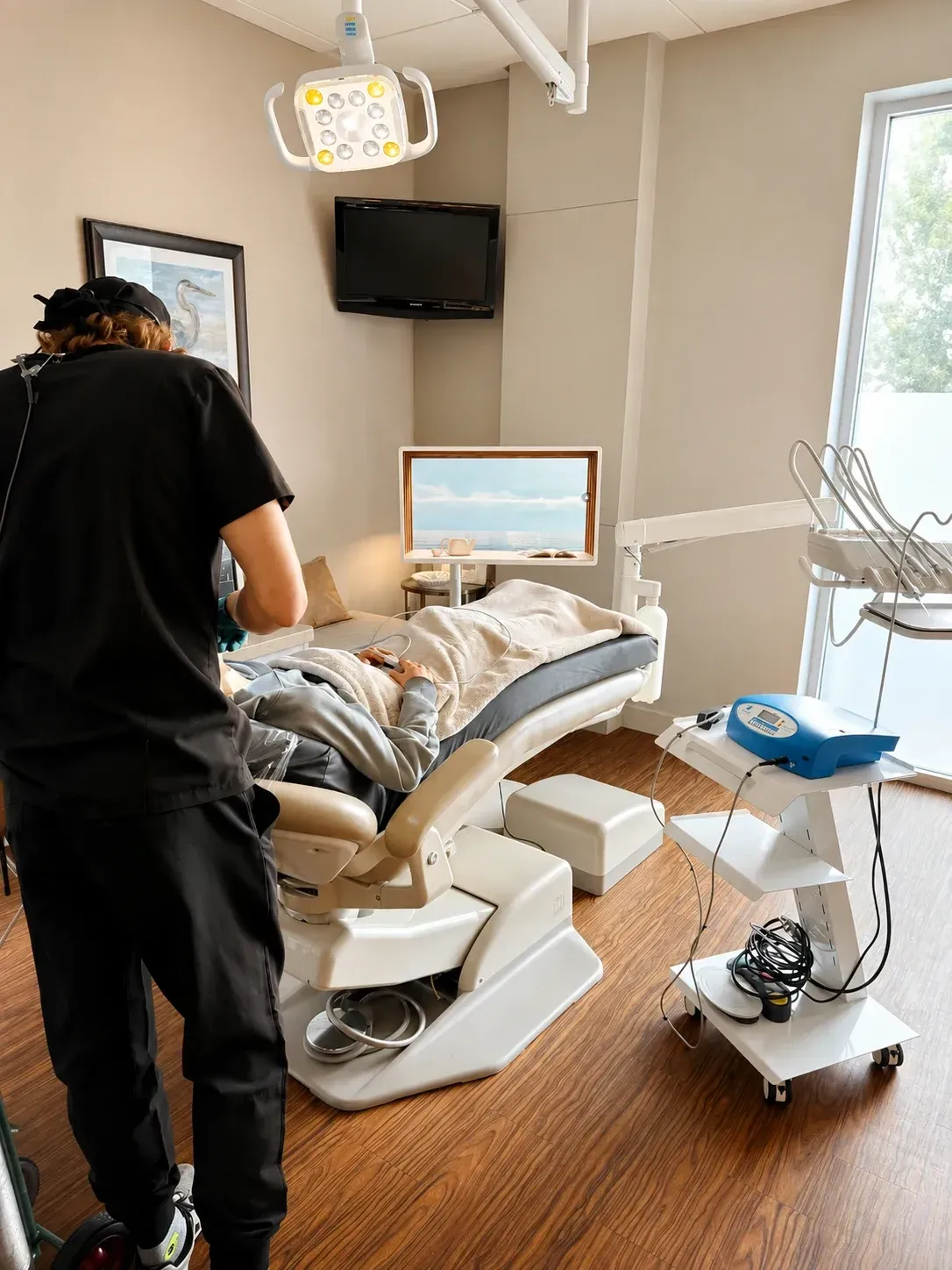 A dentist is placing a dental implant.