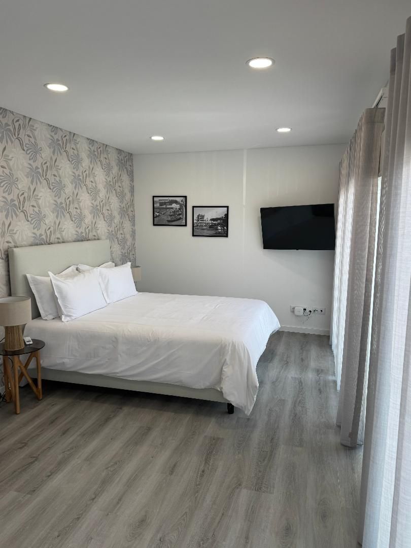 Queen bed with flat screen TV