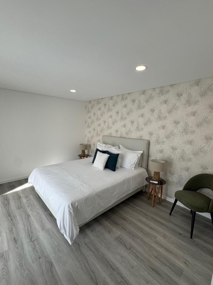 There is a large bed in the middle of the room.
