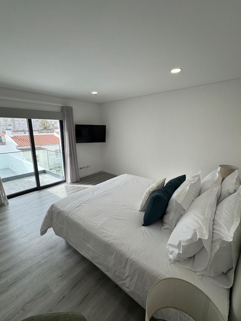 There is a large bed in the middle of the room.