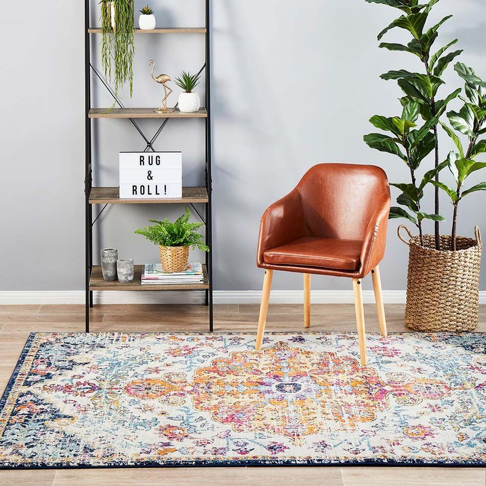 A Shelf With Rugs On The Vinyl Flooring With Chairs And Plant — Cairns Floors and More In Bungalow, QLD
