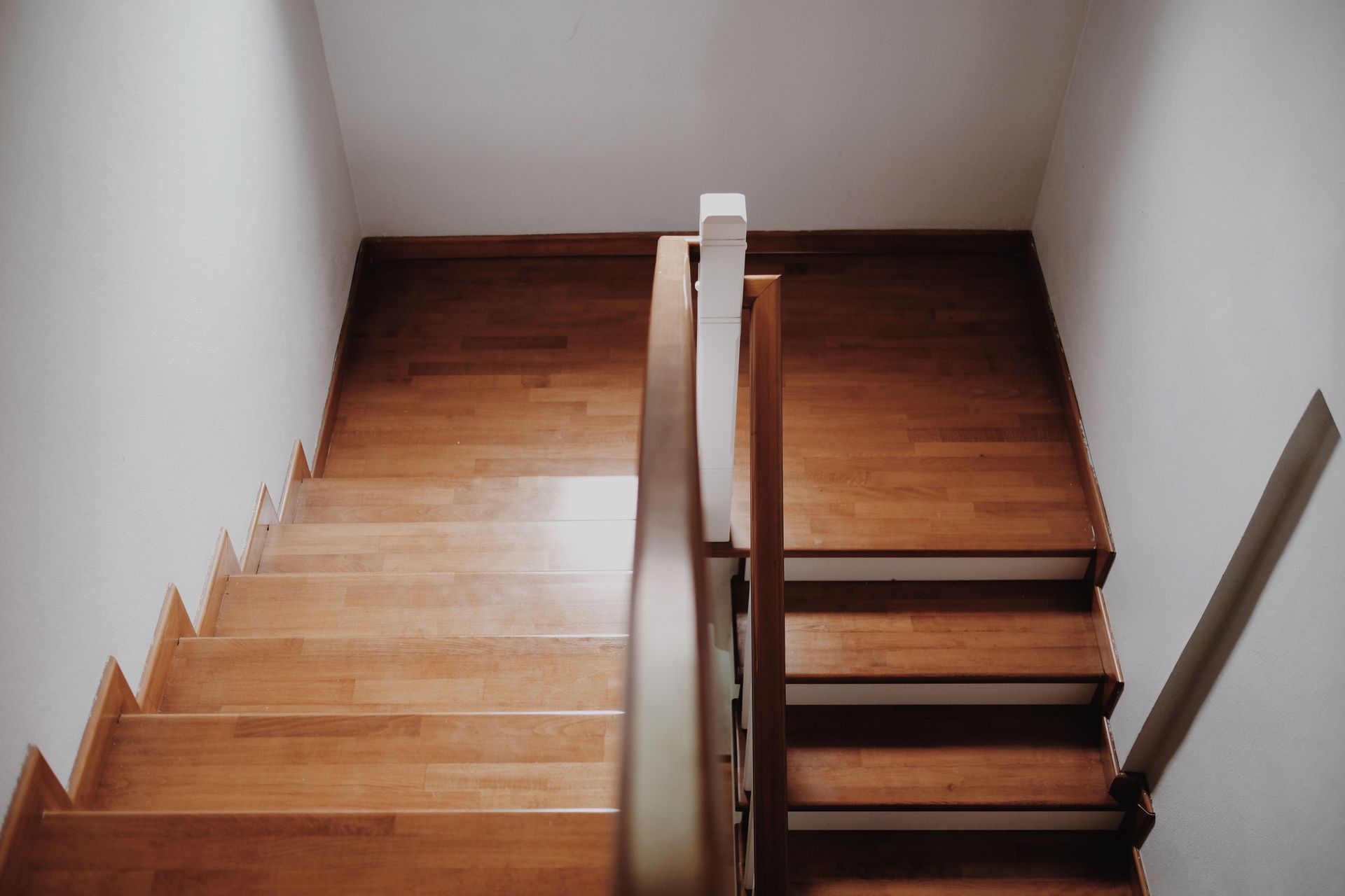 A Hallway With a Lot of Windows and a Carpeted Floor — Cairns Floors and More In Bentley Park, QLD