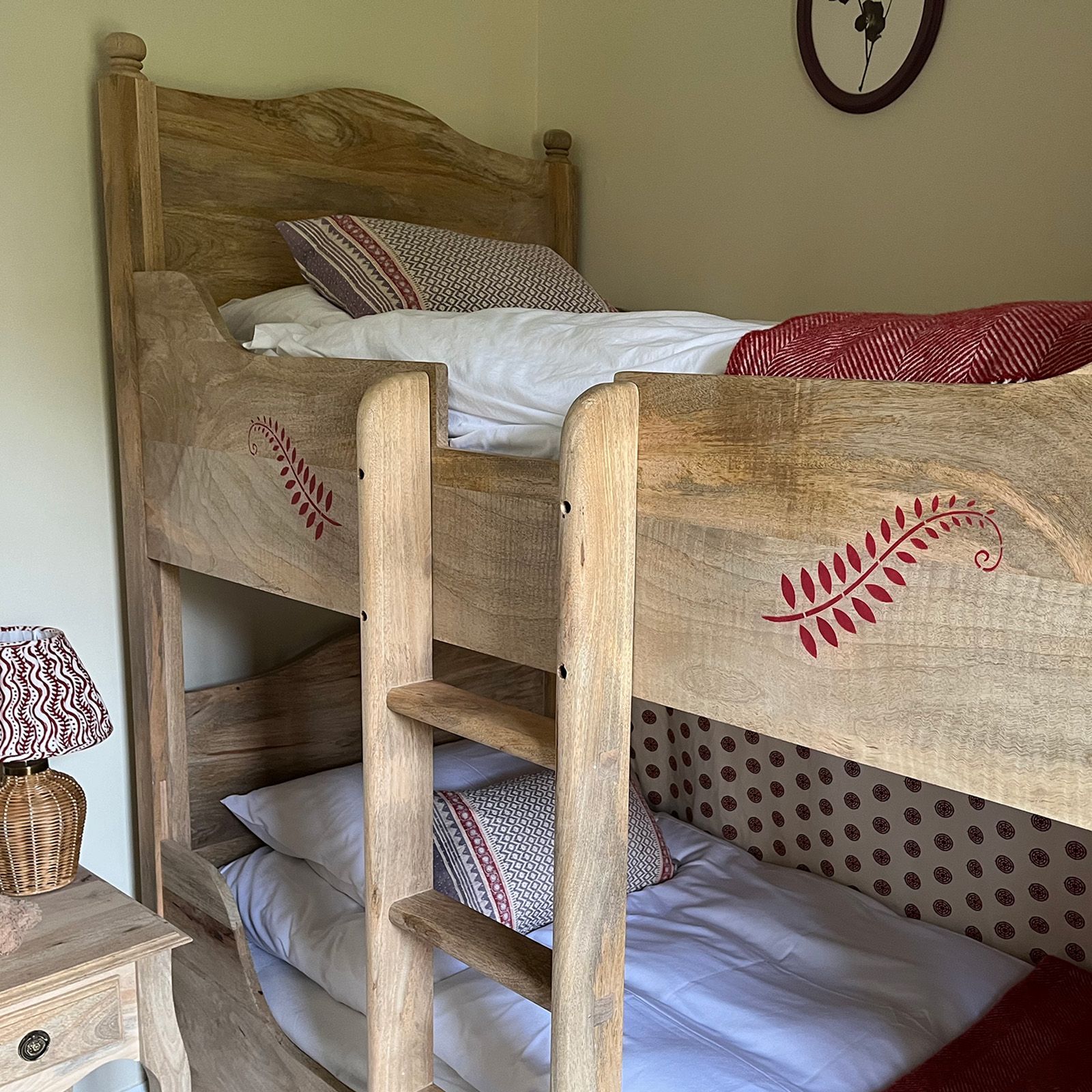 Rusty red stencil on childs bunk bed by Helen Bateman, decorative artist.