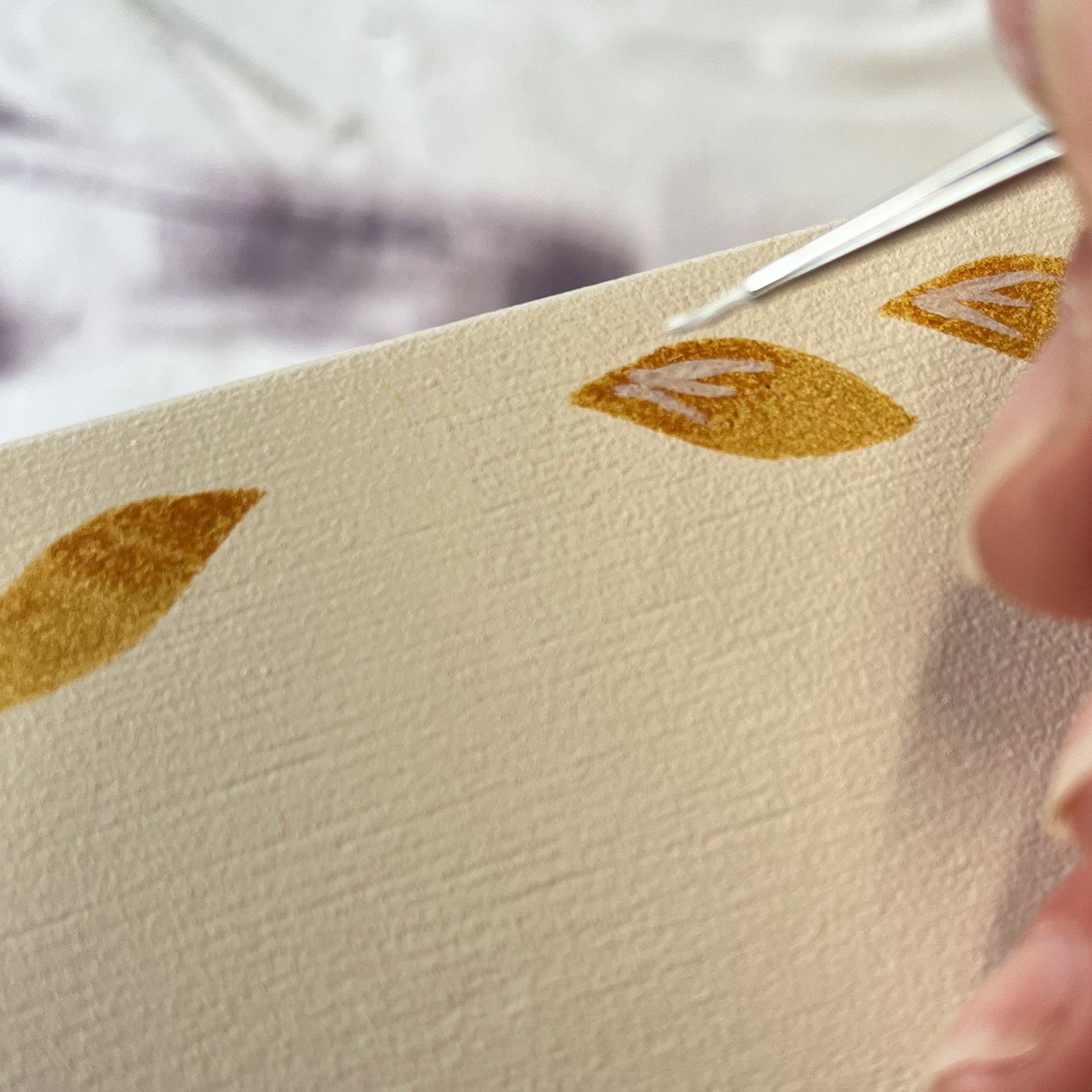 Handpainted design over stenciled stipples