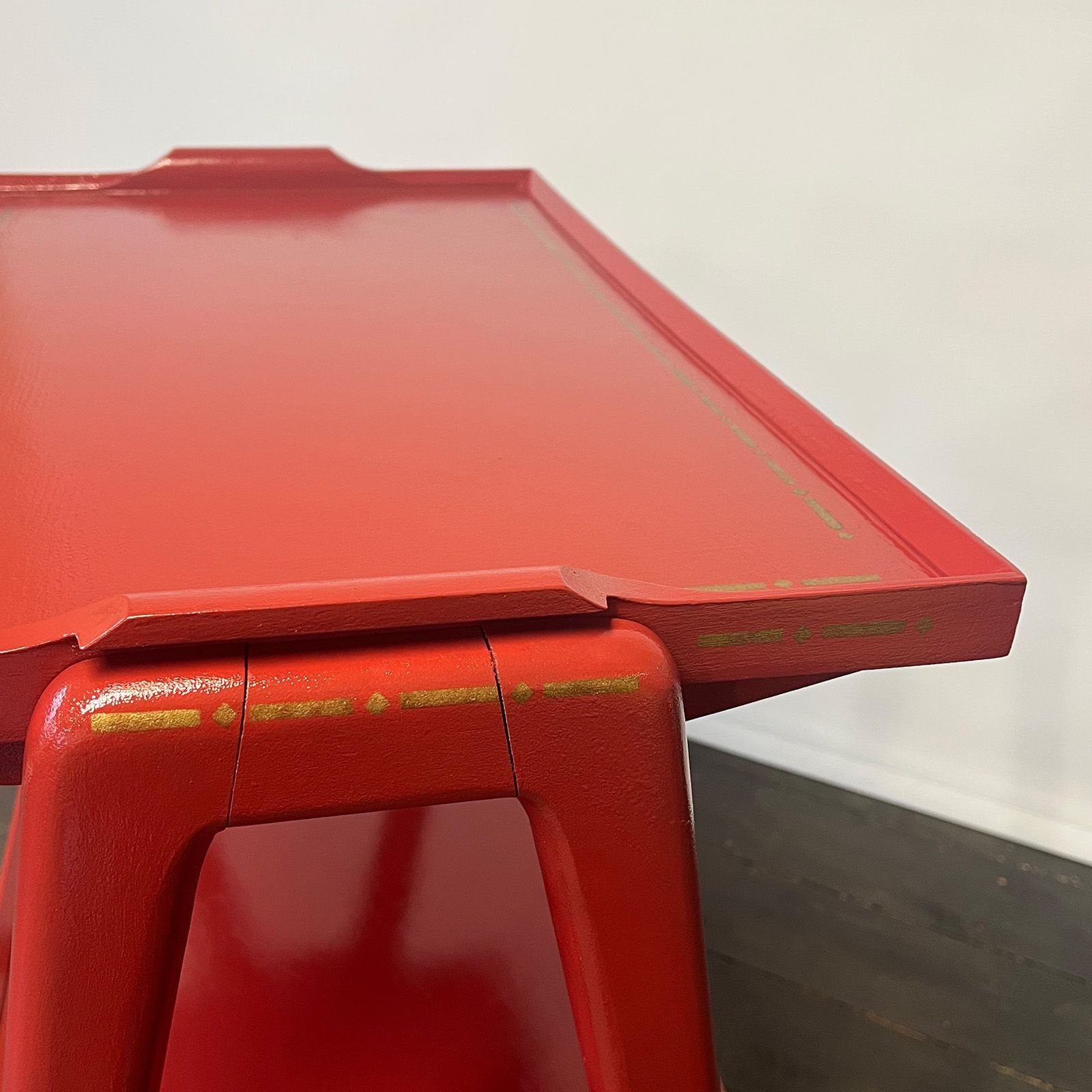 Gold detail borders on a retro red drinks trolley. Painted by Helen Bateman.