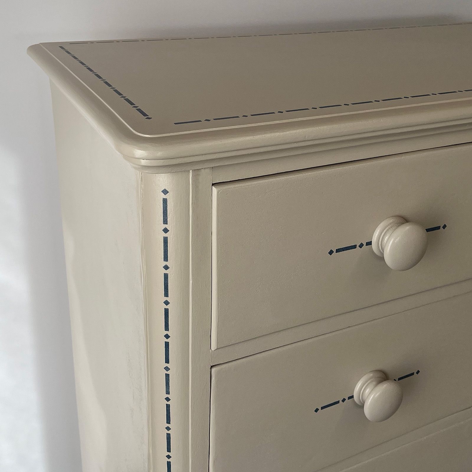 Detail of paynes grey on royal circus beige upcycled  drawers.