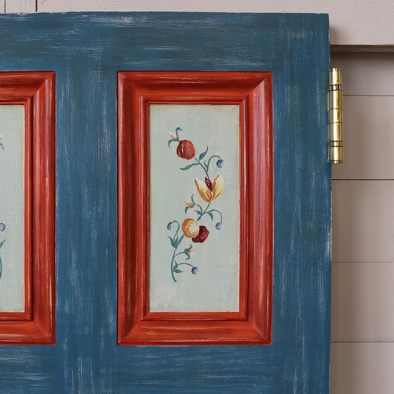 Detail of handpainted floral panels on stair gates