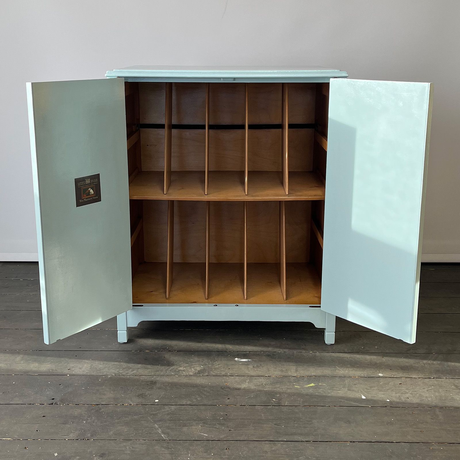 Vinyl record cabinet interior. Doors painted in swedish blue.h