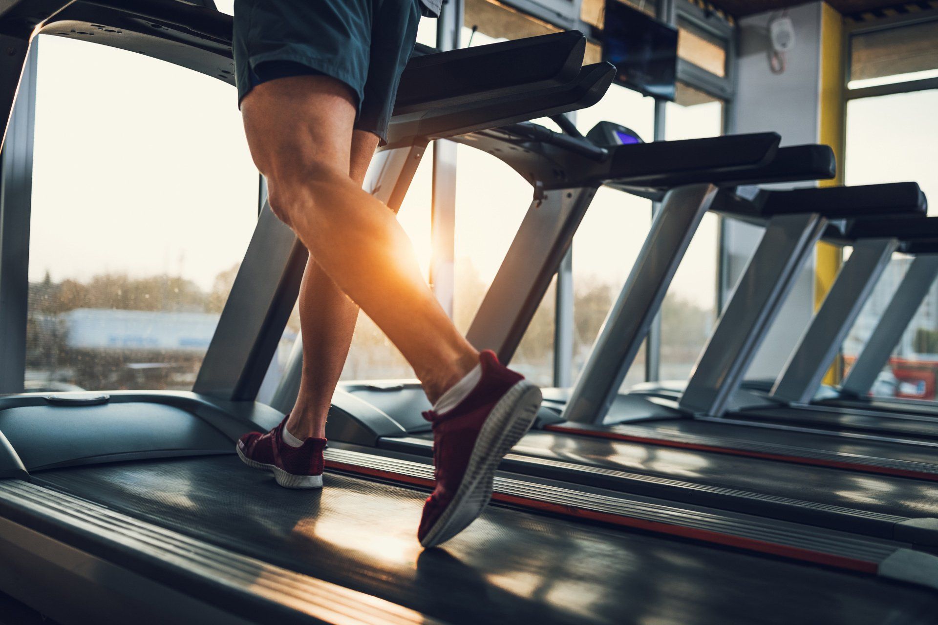 Running on a treadmill in a gym