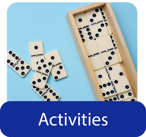 Elderly couple playing cards and smiling with text overlay that says View Our Activity Schedule
