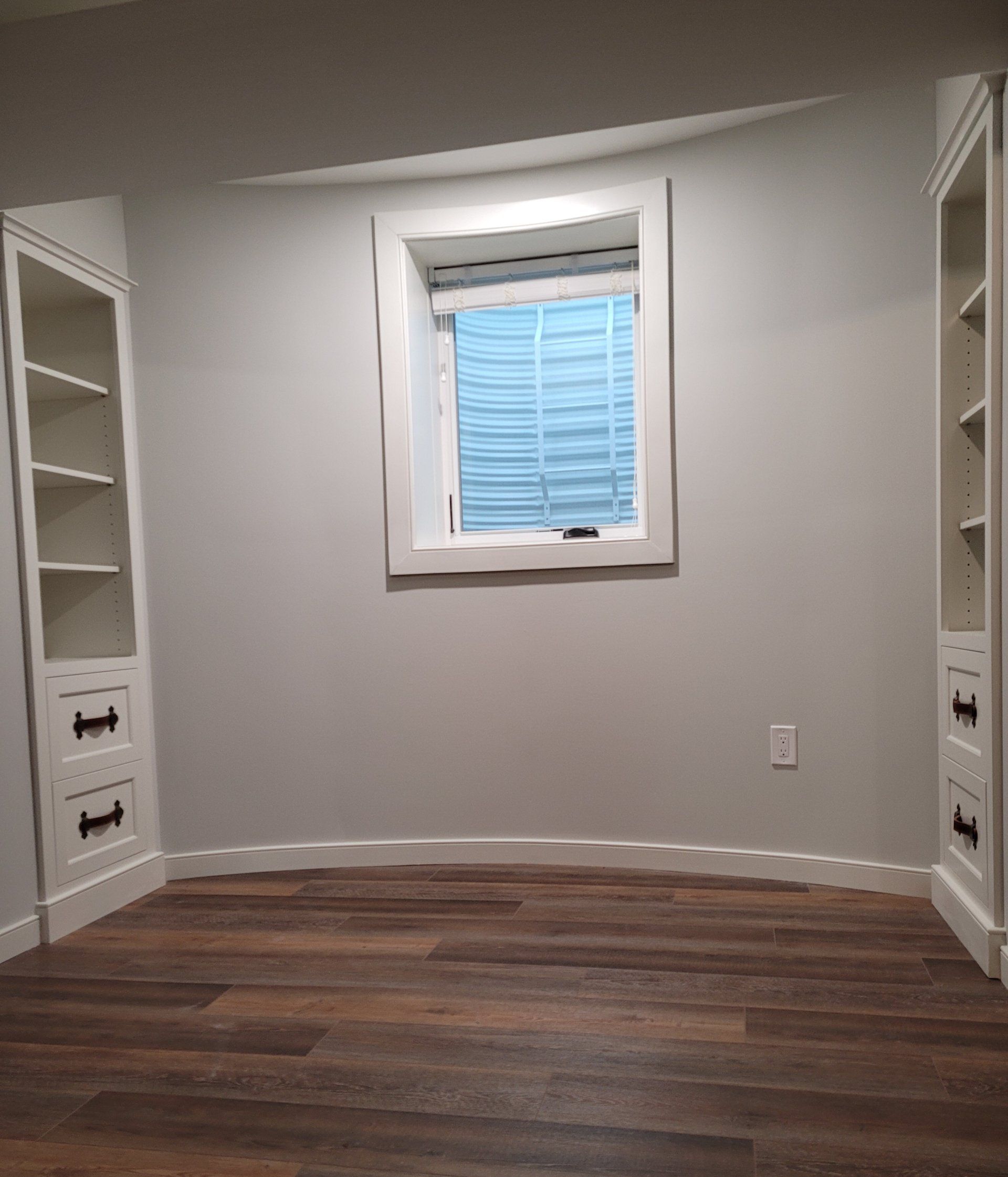 There is a window in the middle of the room.