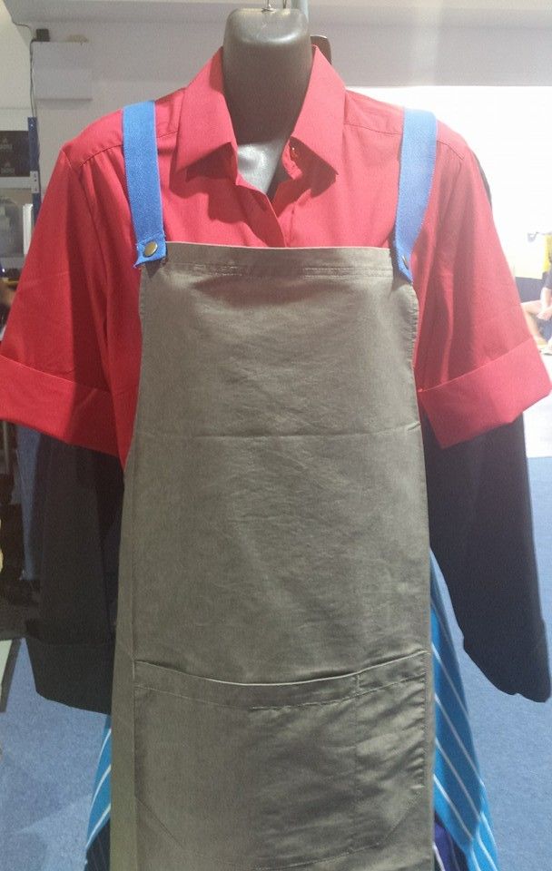 Mannequin Wearing Red Shirt With Cuffed Sleeves and a Gray Apron With Blue Straps — Workwise Clothing Forster in Forster, NSW