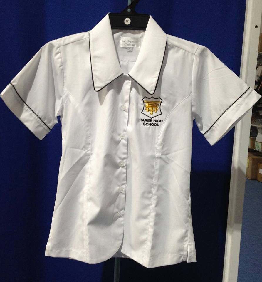 White School Uniform Shirt With Black Trim and Emblem, Hanging on a Hanger — Workwise Clothing Forster in Taree, NSW