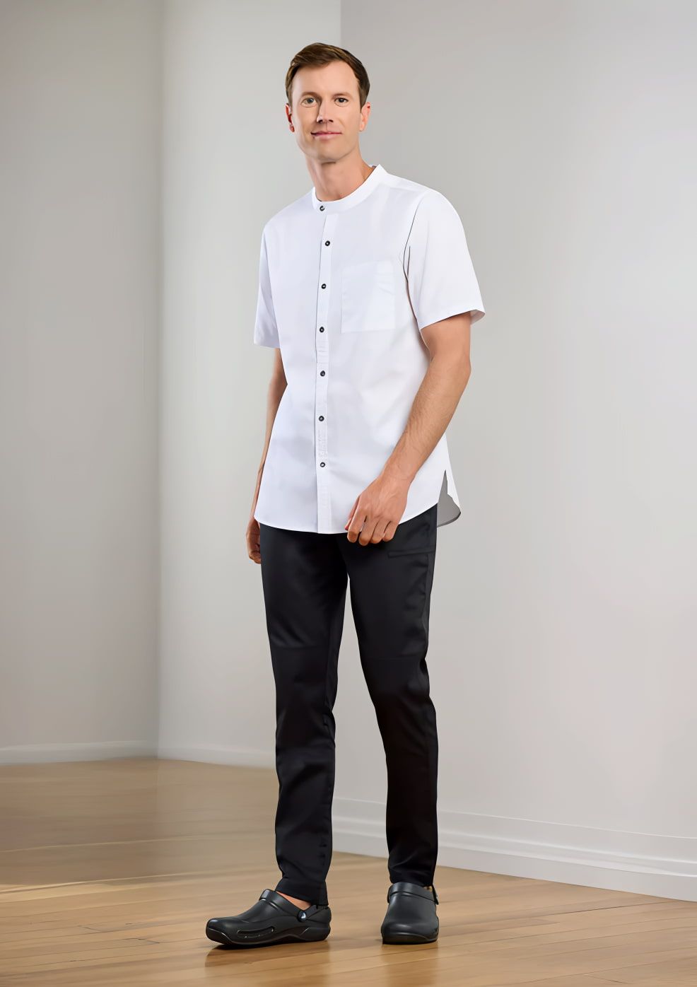 Man in White Shirt and Black Pants, Standing in a Room — Workwise Clothing Forster in Forster, NSW