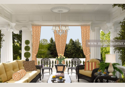 A living room with a couch and chairs and a chandelier