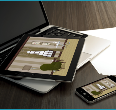 A tablet is sitting on top of a laptop next to a cell phone A tablet is sitting on top of a laptop next to a cell phone