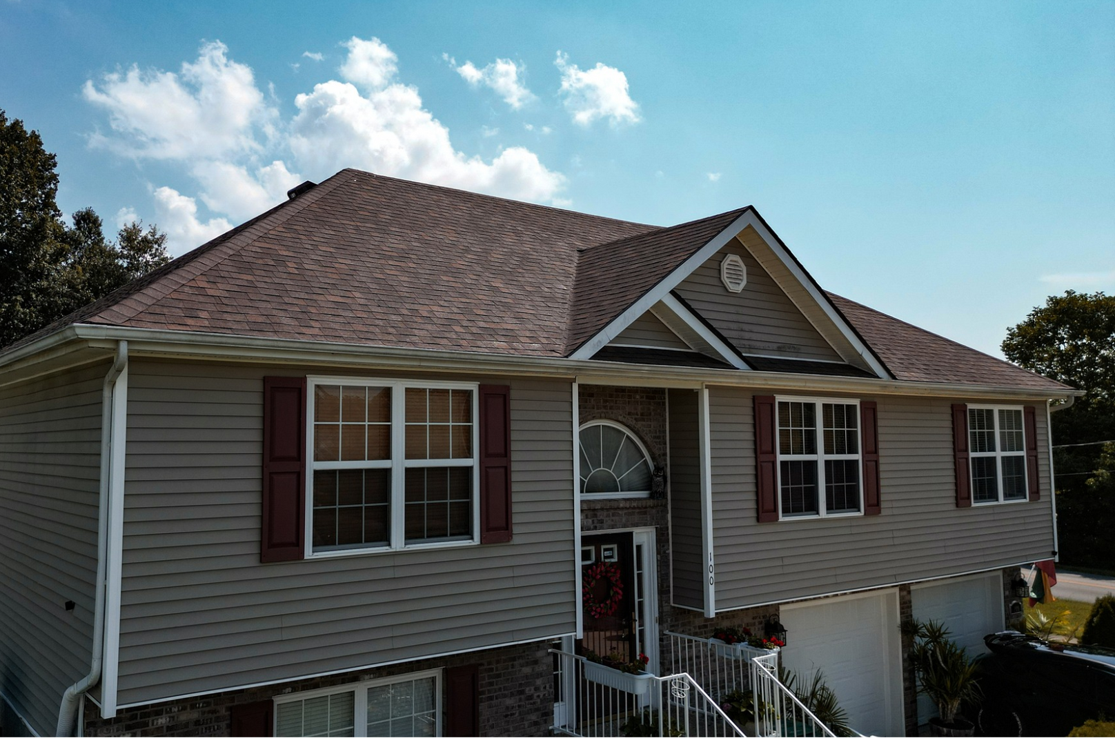 a brick house with a roof that is being installed