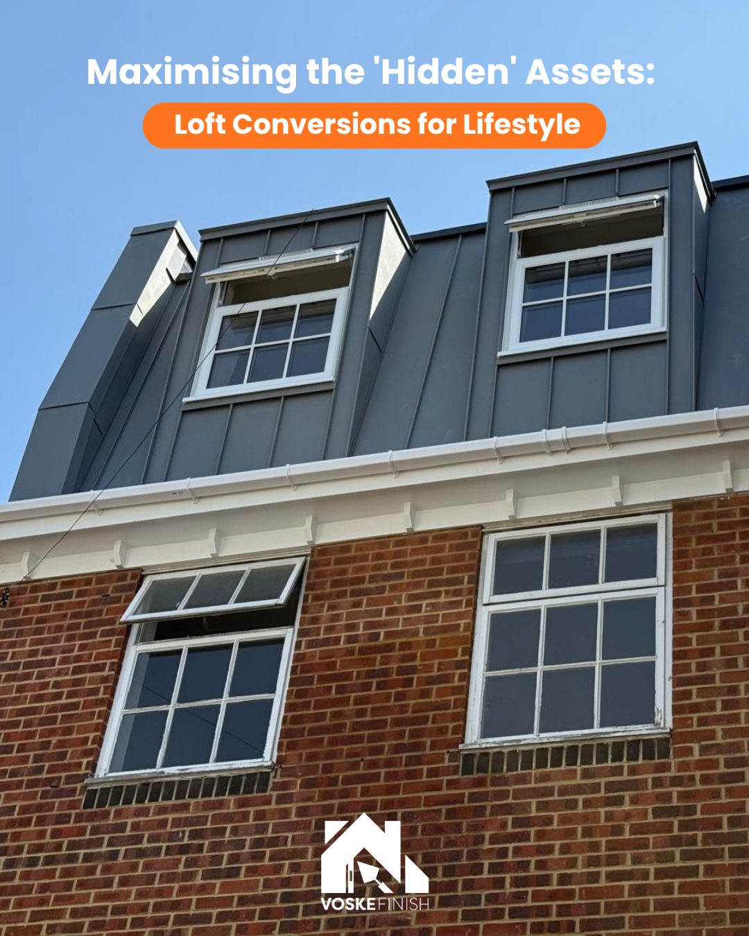 Modern zinc dormer loft conversion featuring custom dark grey windows and a vertical roof extension.