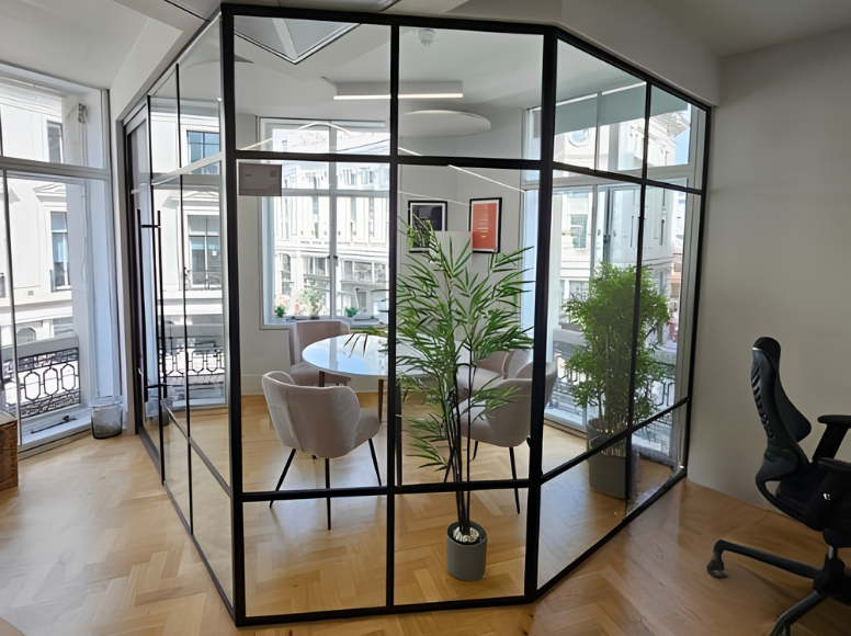 Commercial office interior featuring sleek black metal and glass partition walls by VoskeFinish