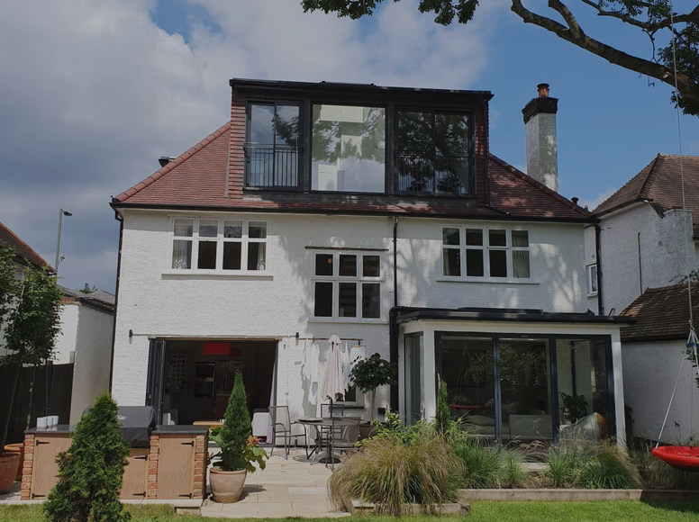 Exterior view of a completed roof extension and residential renovation project in London