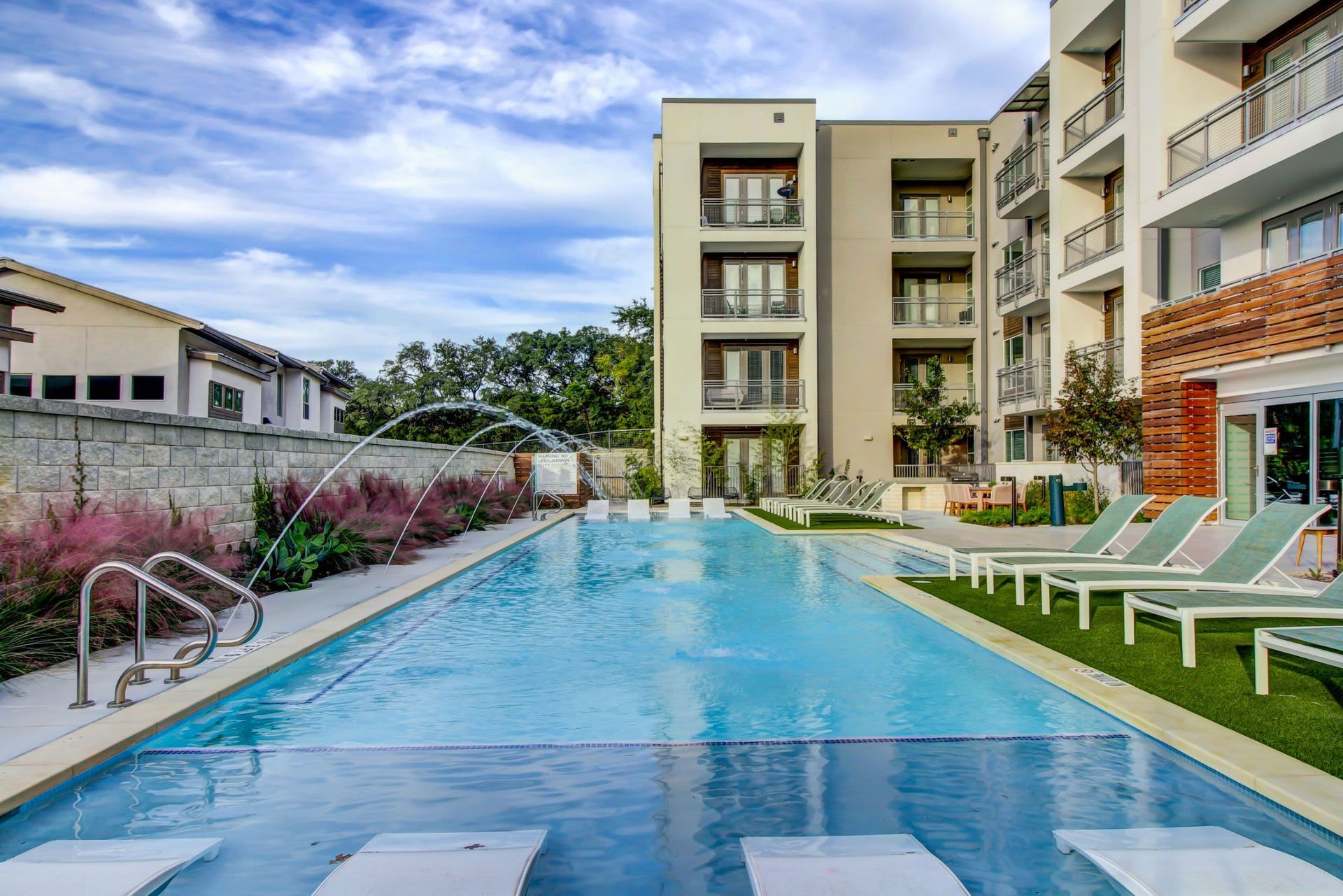 there is a large swimming pool in the middle of a building at Westerly 360 in Austin, TX.
