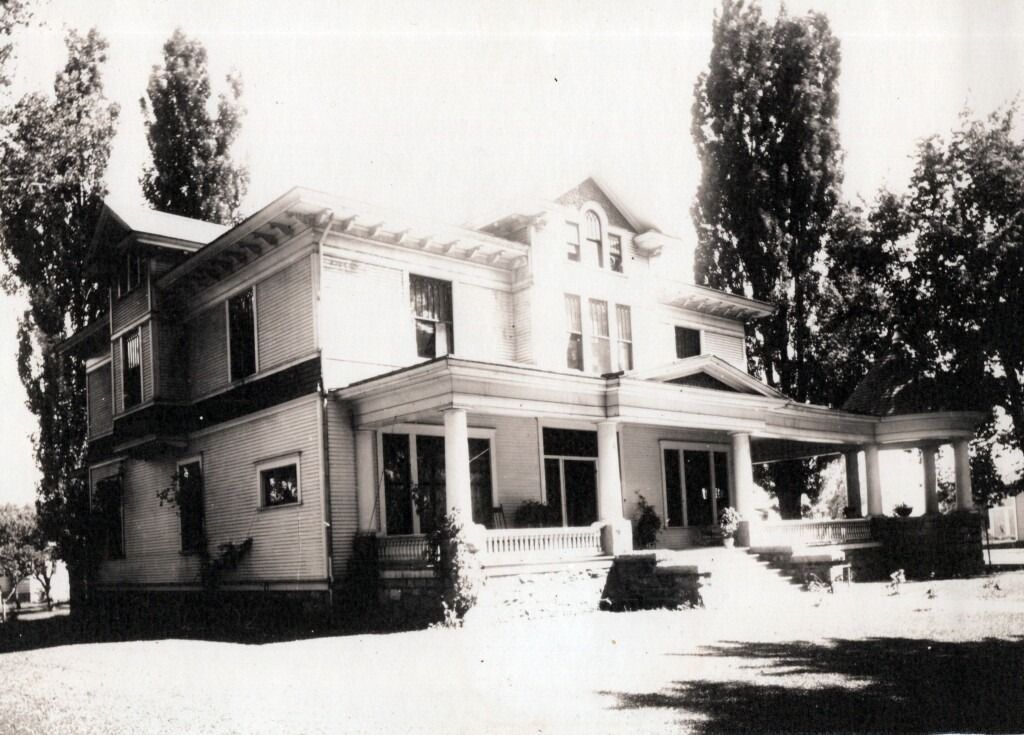 Old two-story house with a wraparound porch