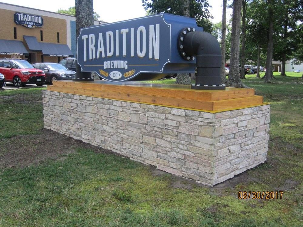 A sign that says tradition brewing on it