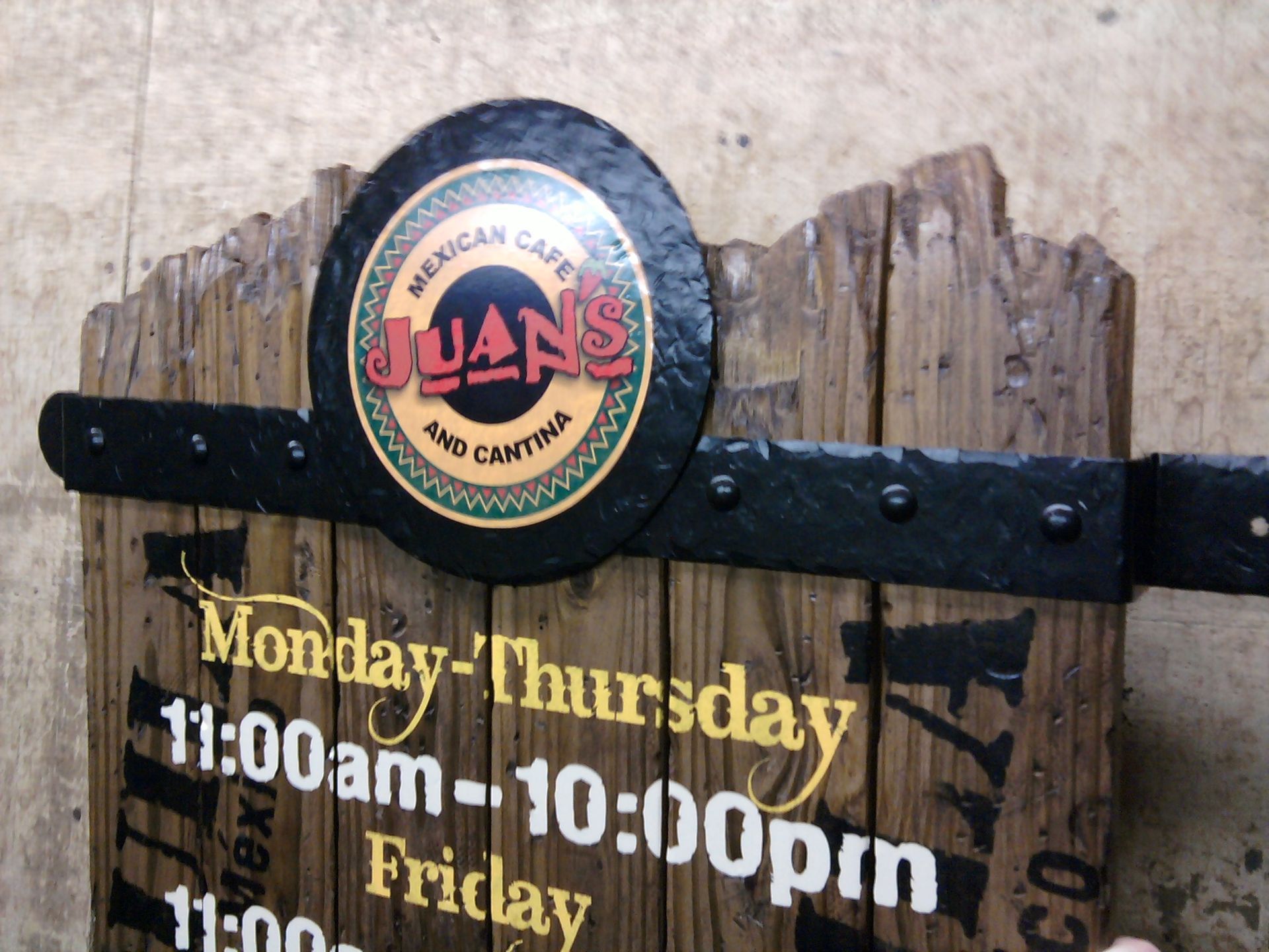 A wooden sign for juan 's mexican cafe and cantina