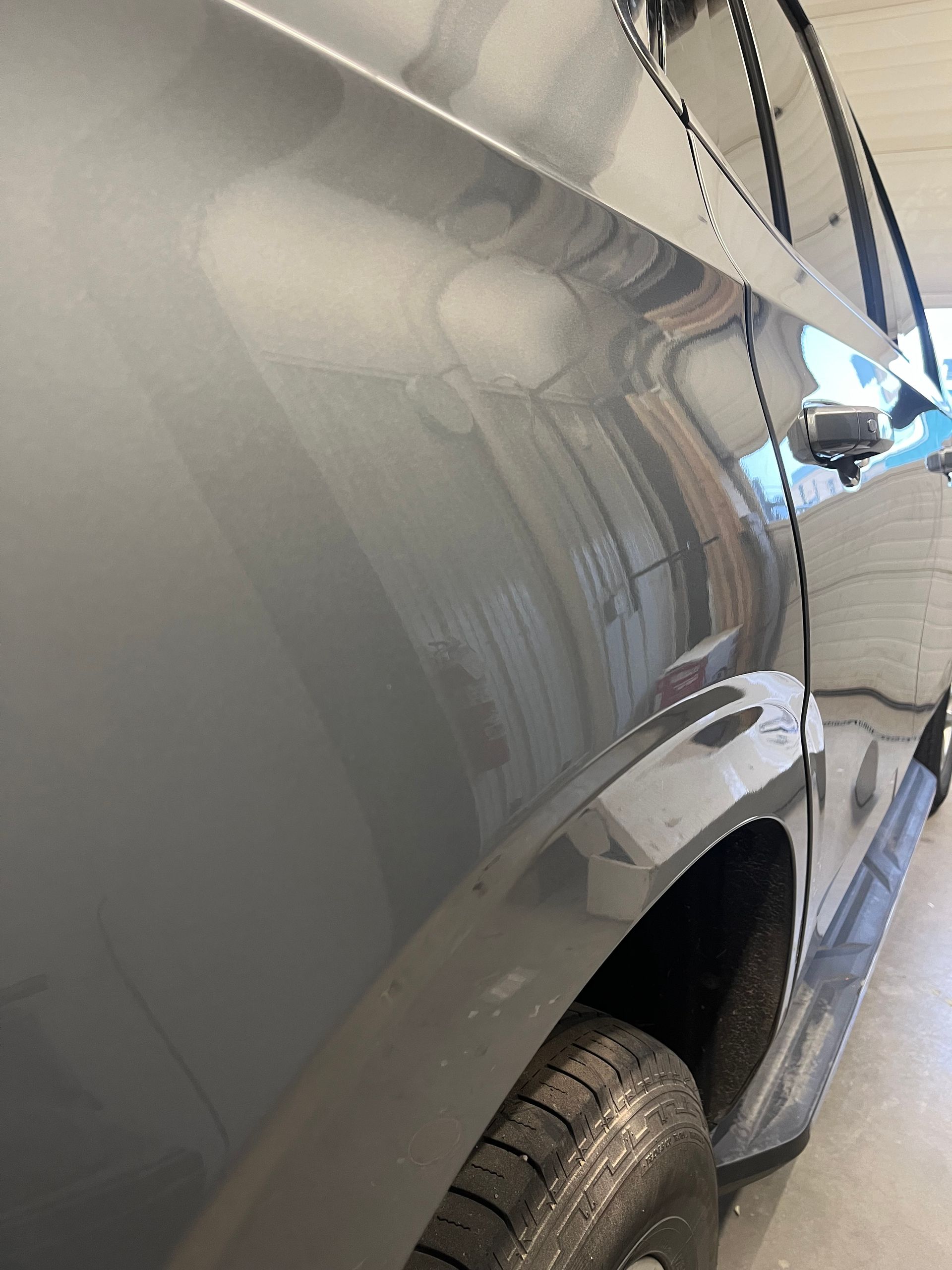 GMC Suburban quarter panel after paintless dent repair