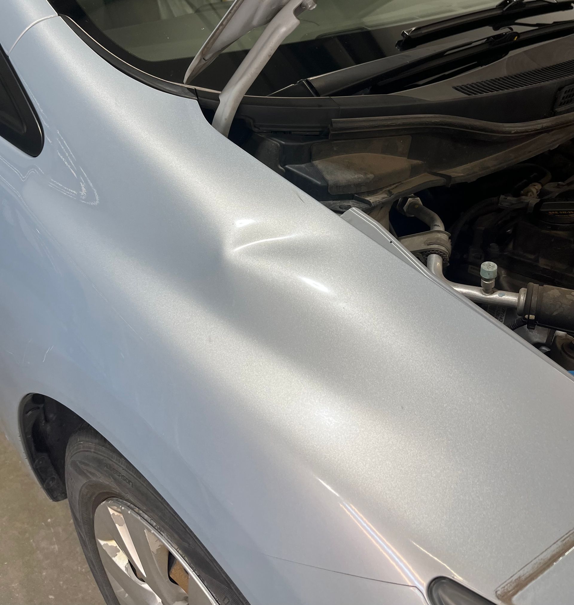 Honda Civic Fender dent before paintless dent repair