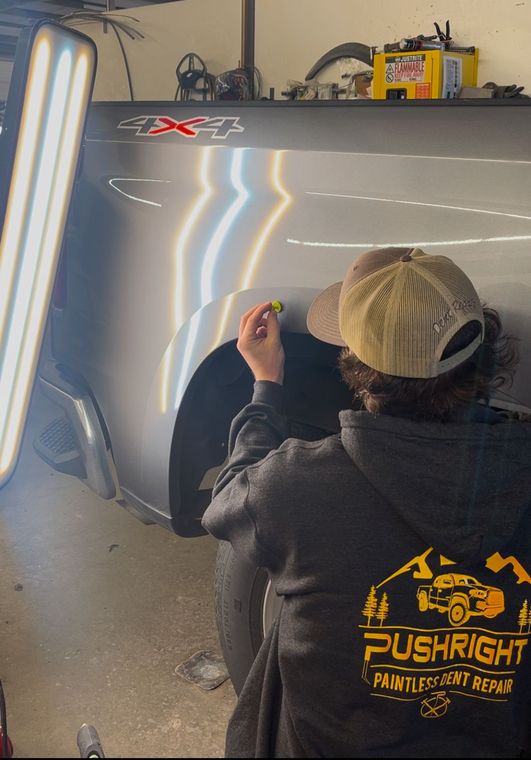 Paintless dent repair glue pulling Silverado bedside
