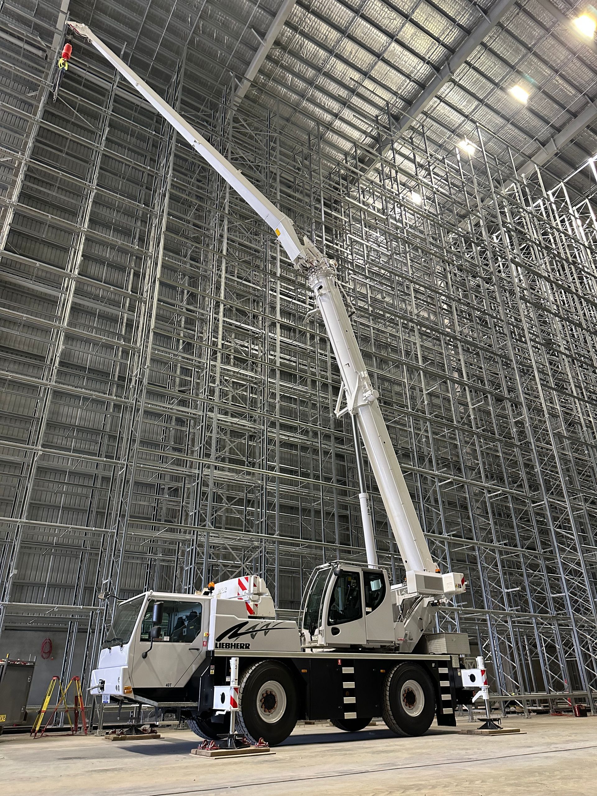 Crane lifting steel beams