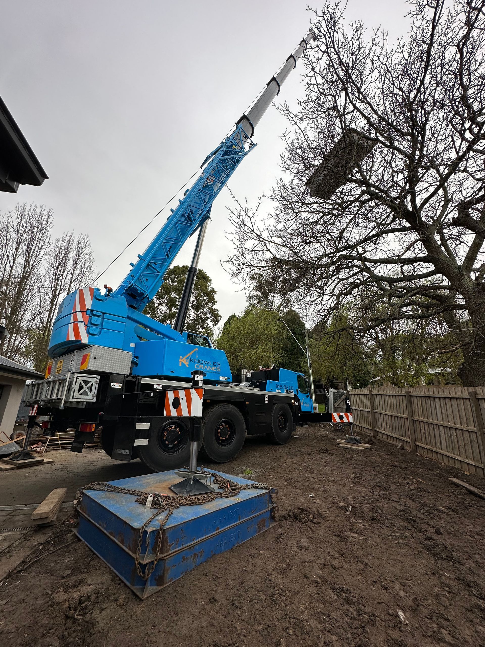 Crane with outriggers extended