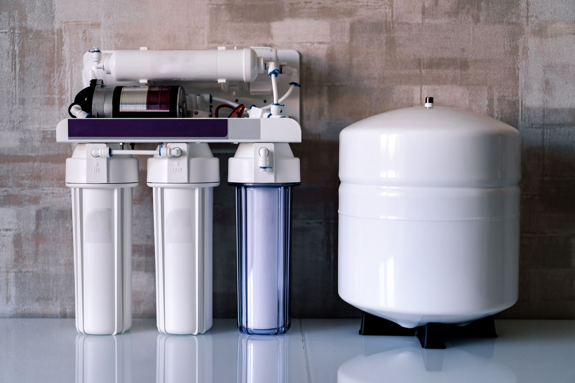 A water filter is sitting on a table next to a tank in Atlanta, GA