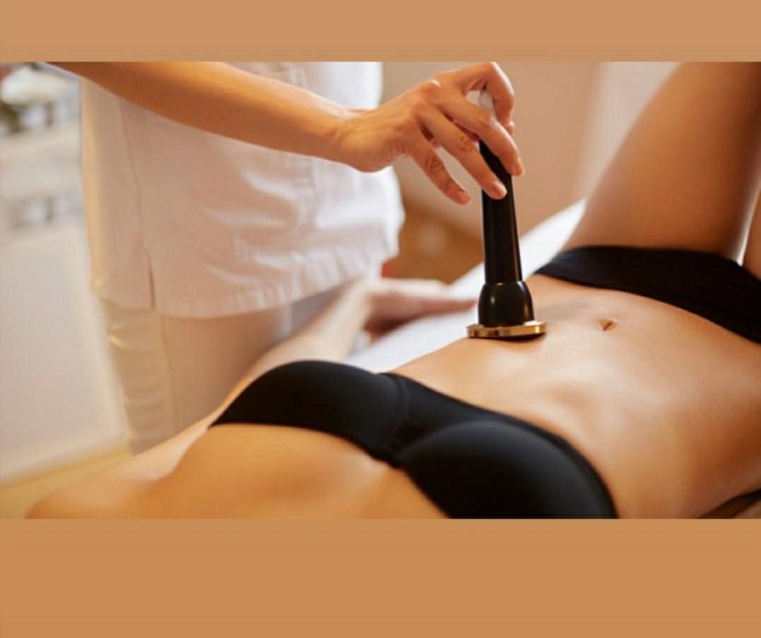 Woman receiving tummy body sculpting