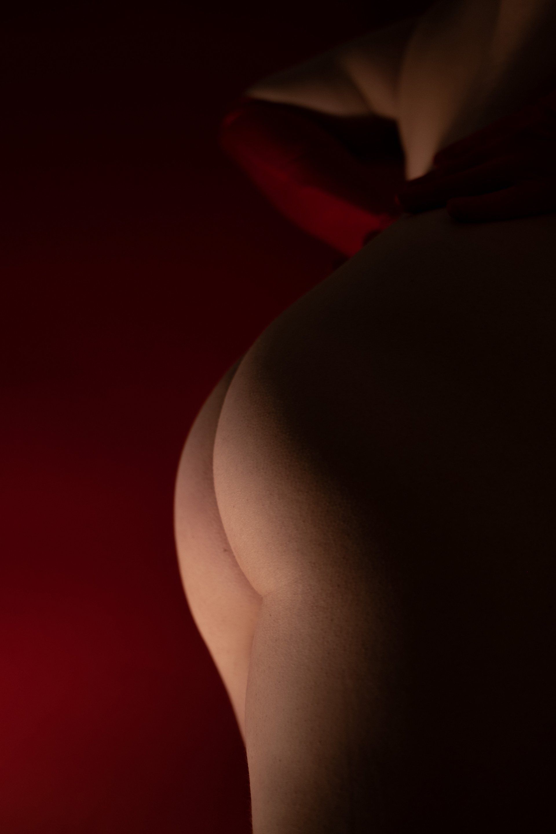 Red wall artistic woman buttock
