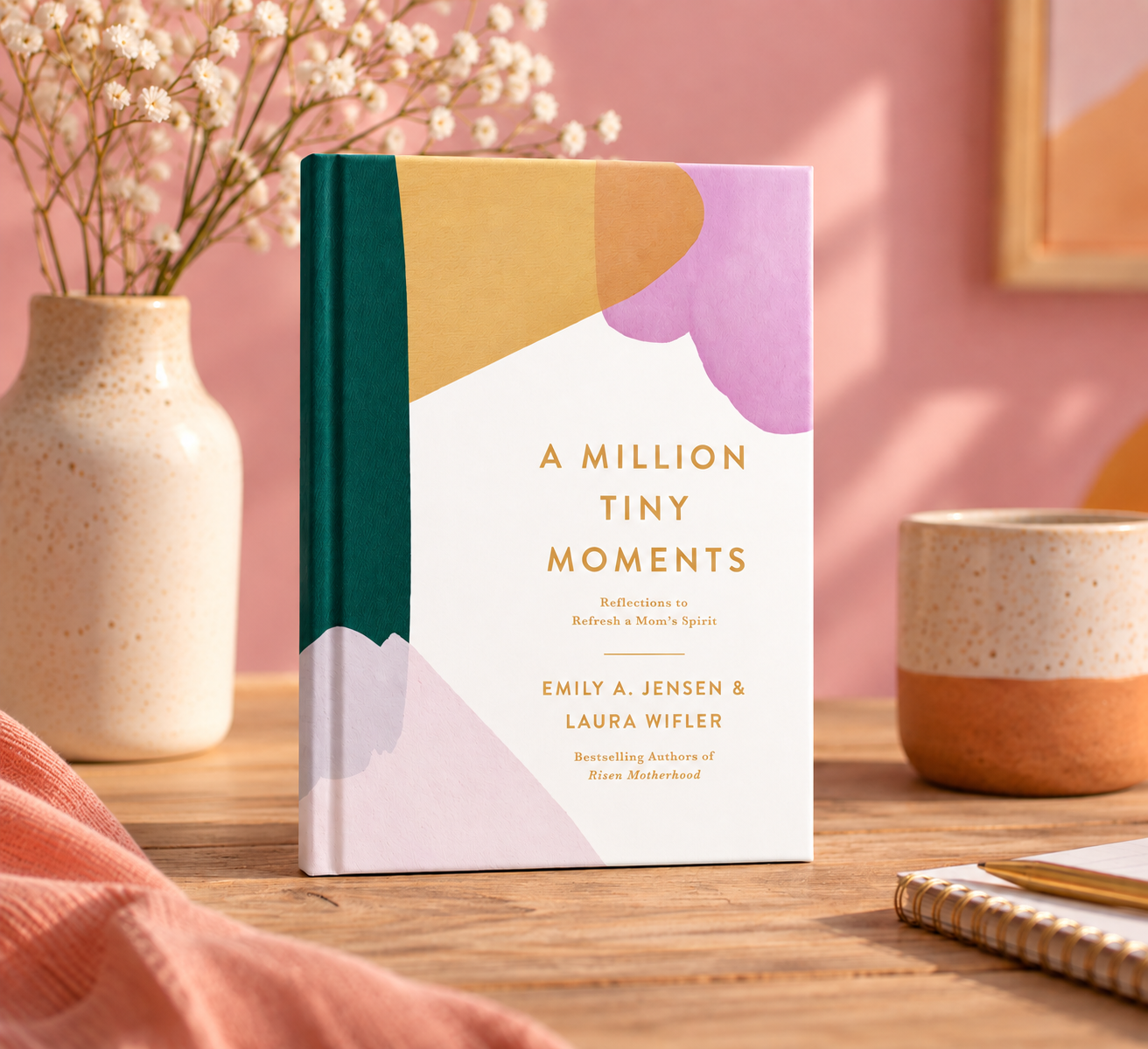 Colorful book titled “A Million Tiny Moments” standing on a wooden desk in a pastel room